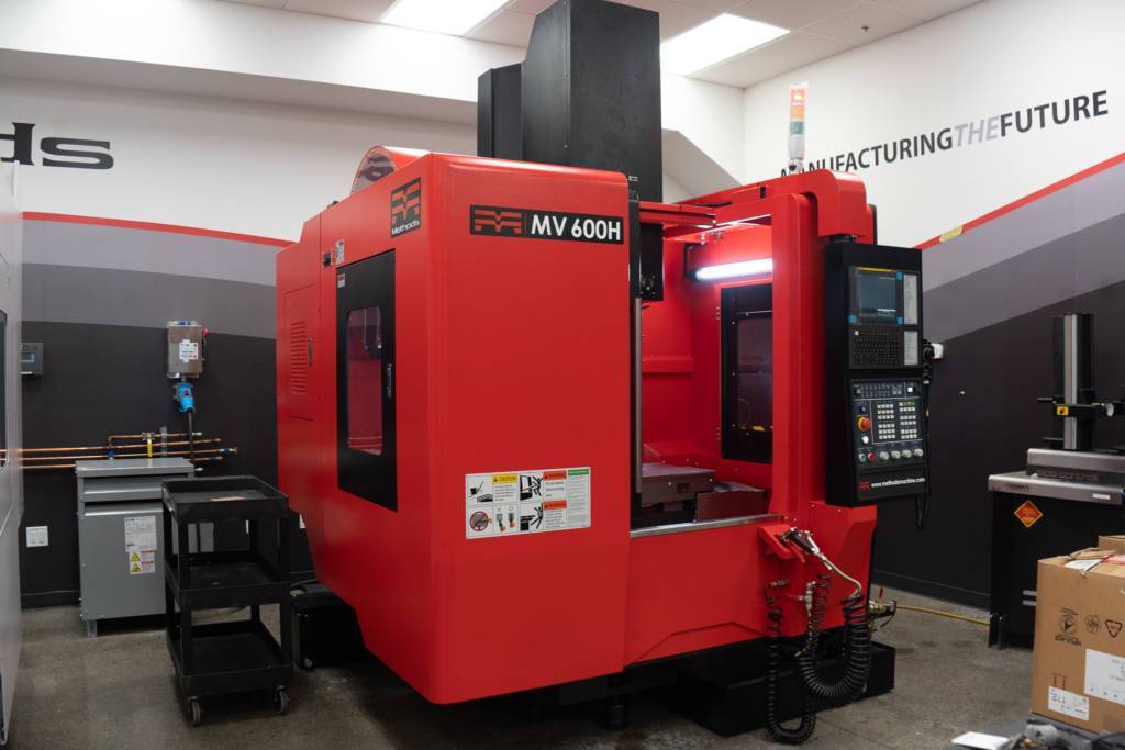front corner view of the Methods MV 600H vertical CNC machining center built by Methods Machine Tools
