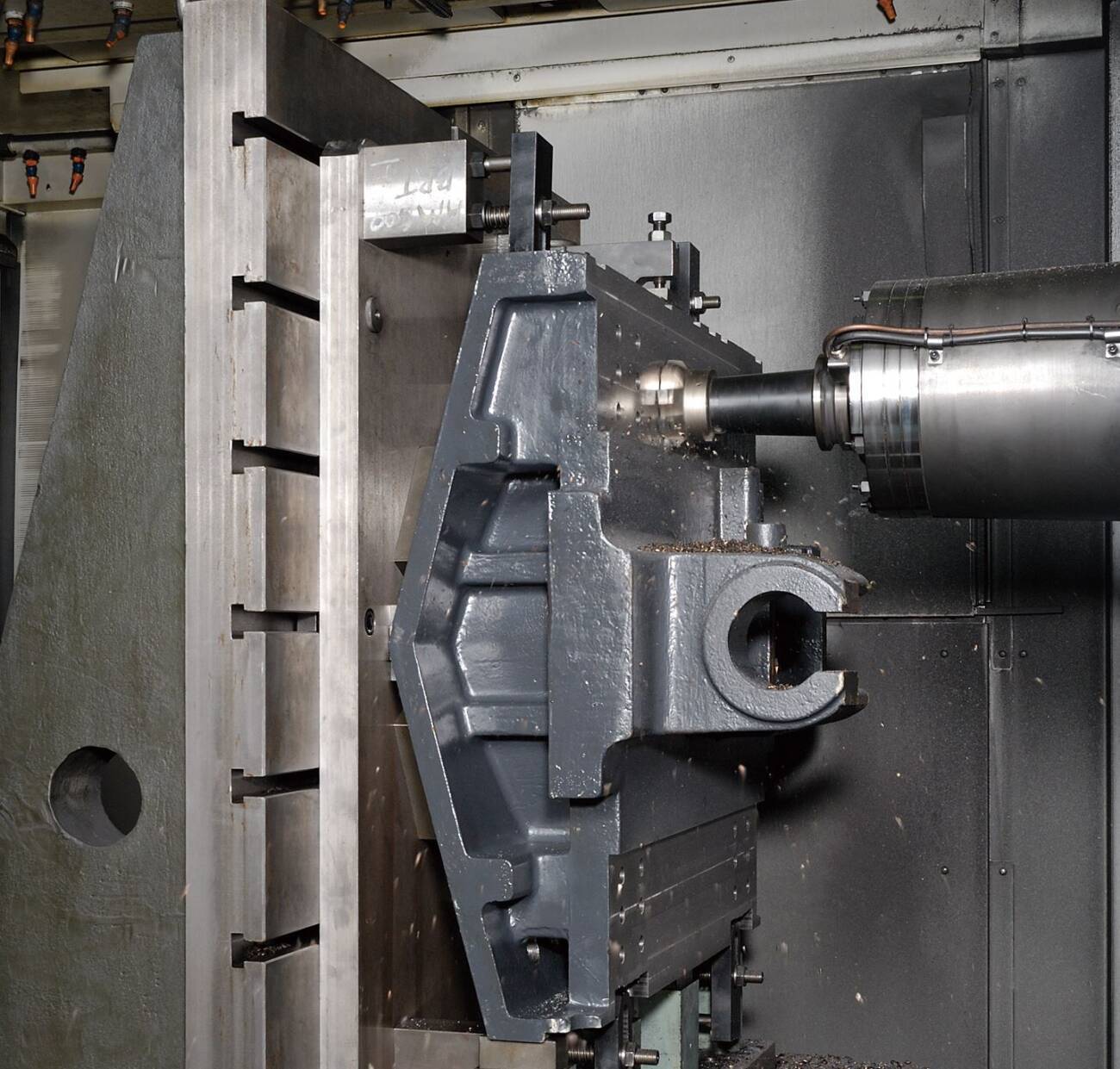 a horizontal lathe milling a part inside a cnc machine