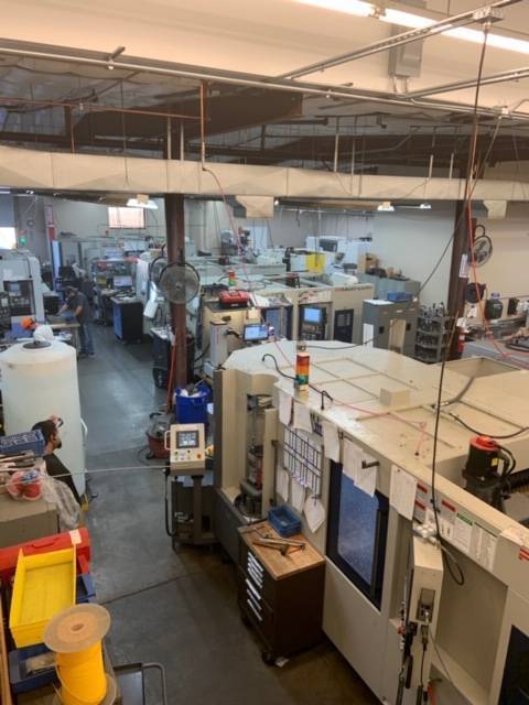 Precision CNC machine shop with machining and manufacturing equipment