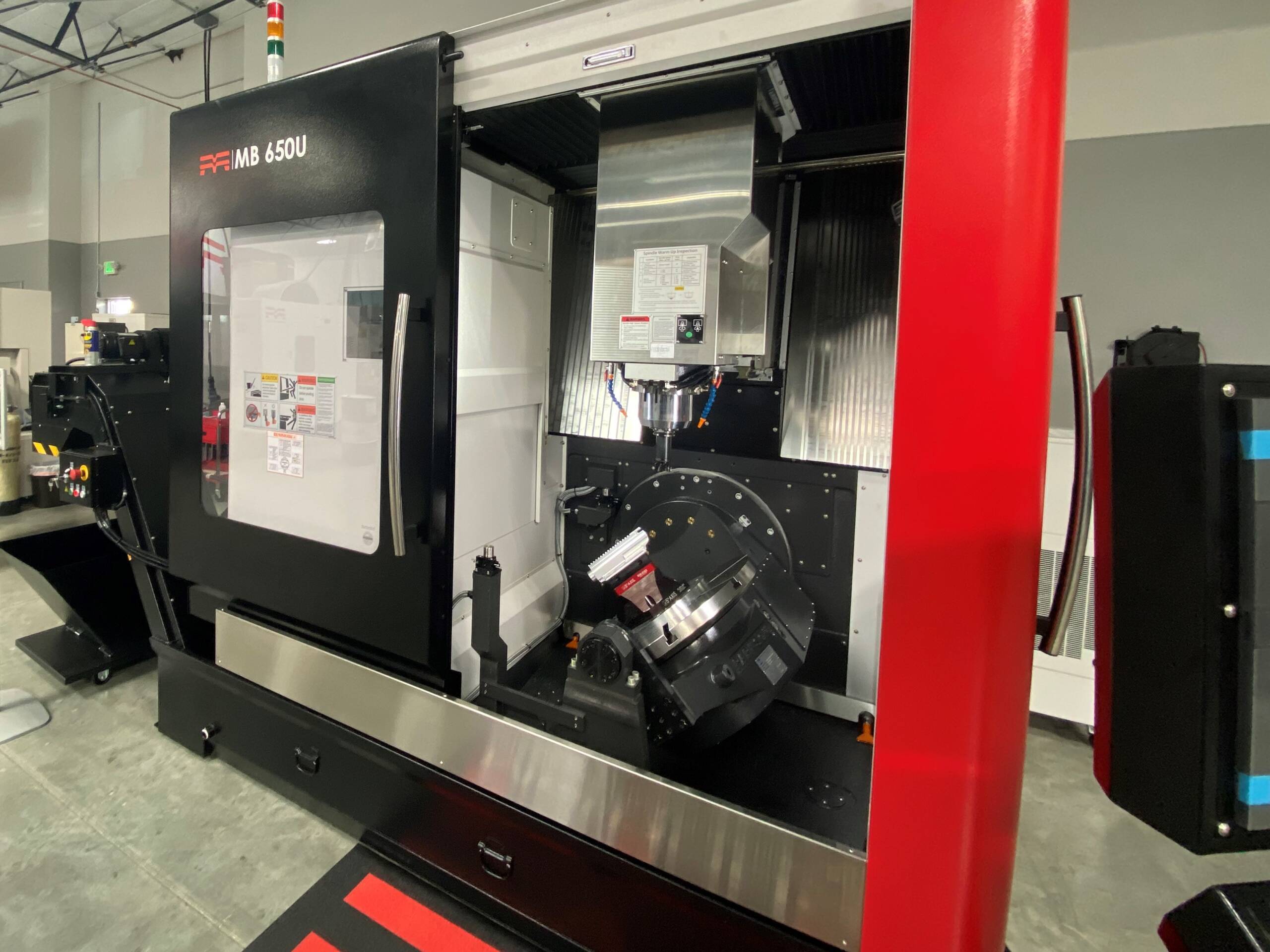 Methods MB650U 5-axis CNC machining center with machining enclosure open