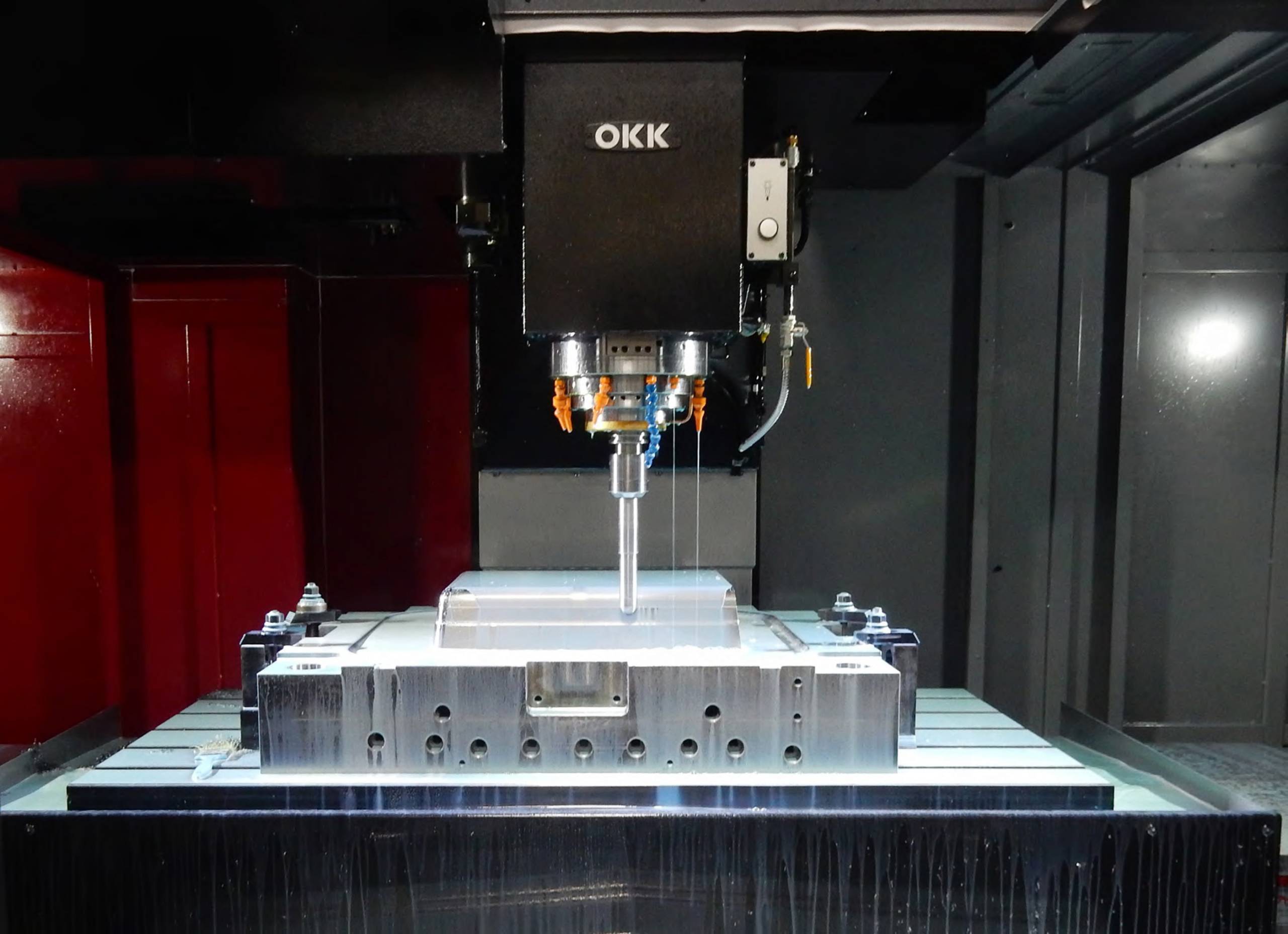 OKK vertical CNC machining center spindle and machining area