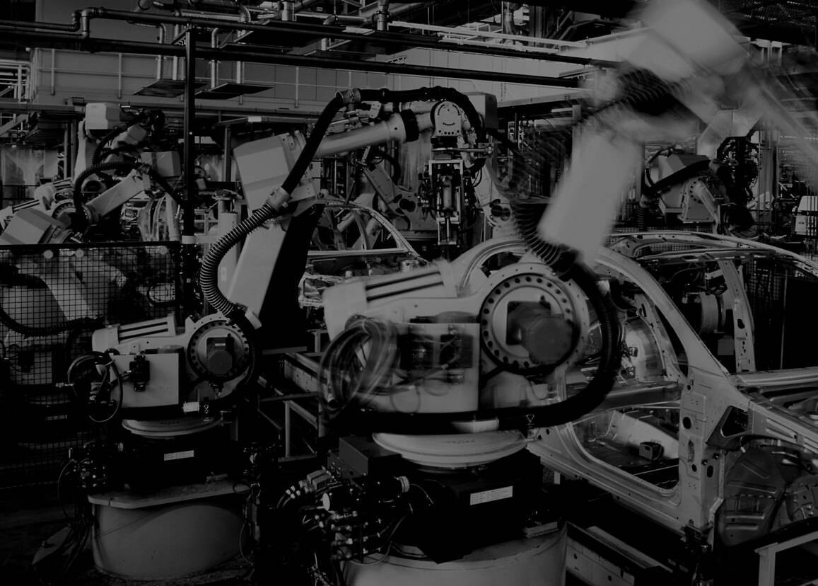 assembly line in an automotive manufacturing facility with automated robots and high tech machines