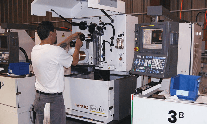 engineer working on cnc machine