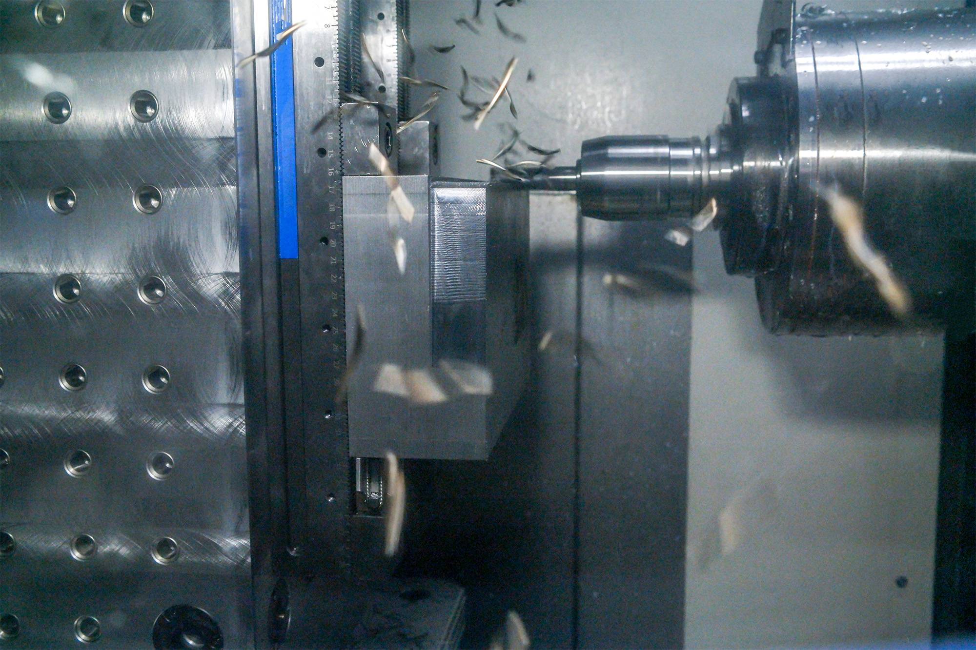 KIWA CNC machining center performing precision metal machining
