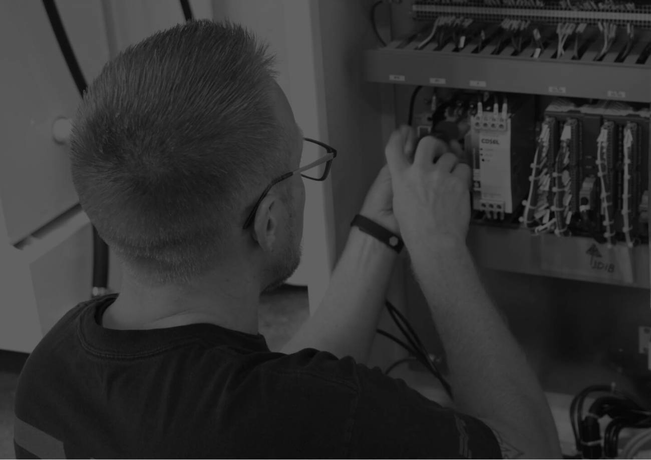 A technician working on a machine