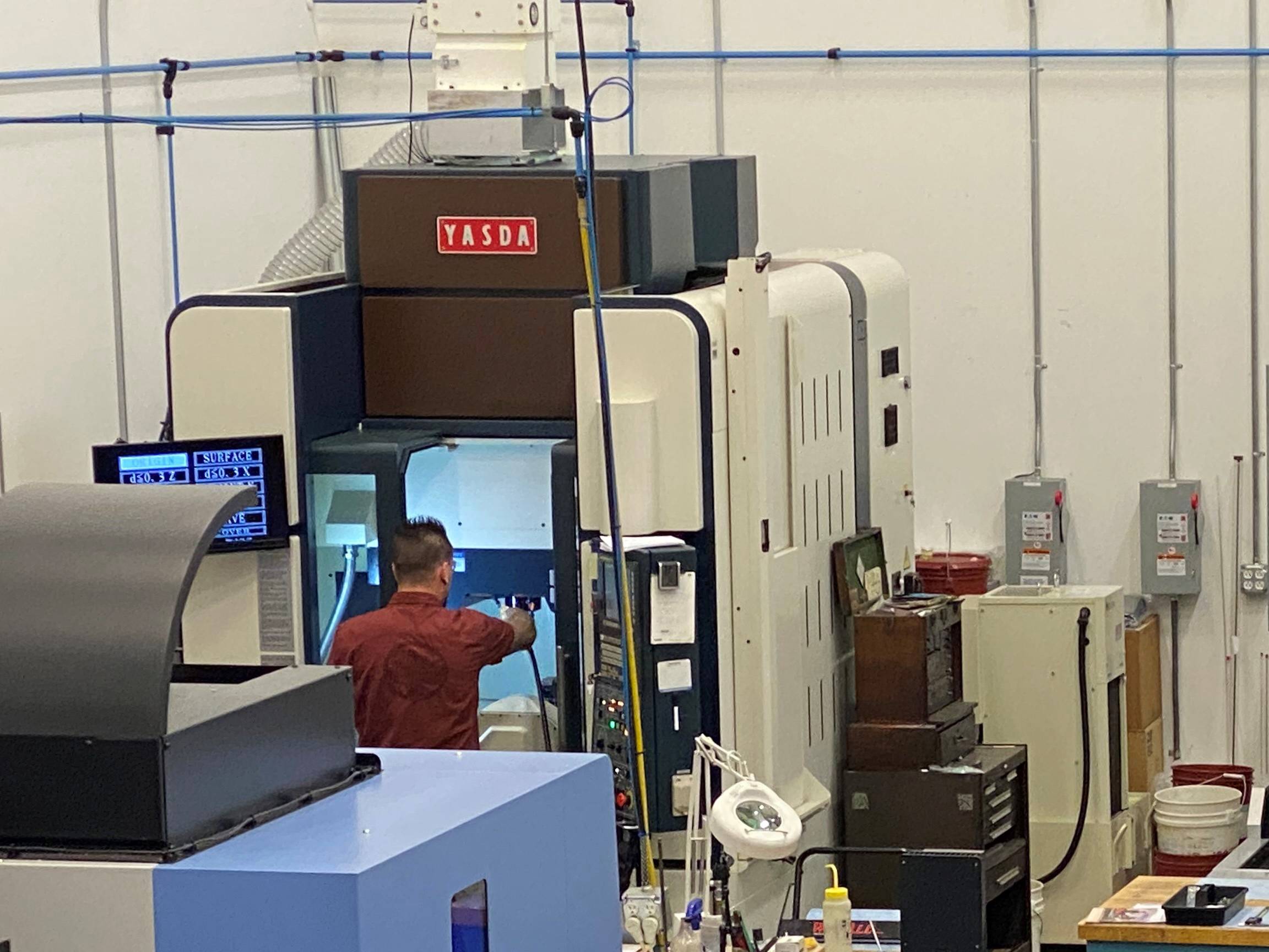YASDA high-precision vertical CNC machining center in a manufacturing facility